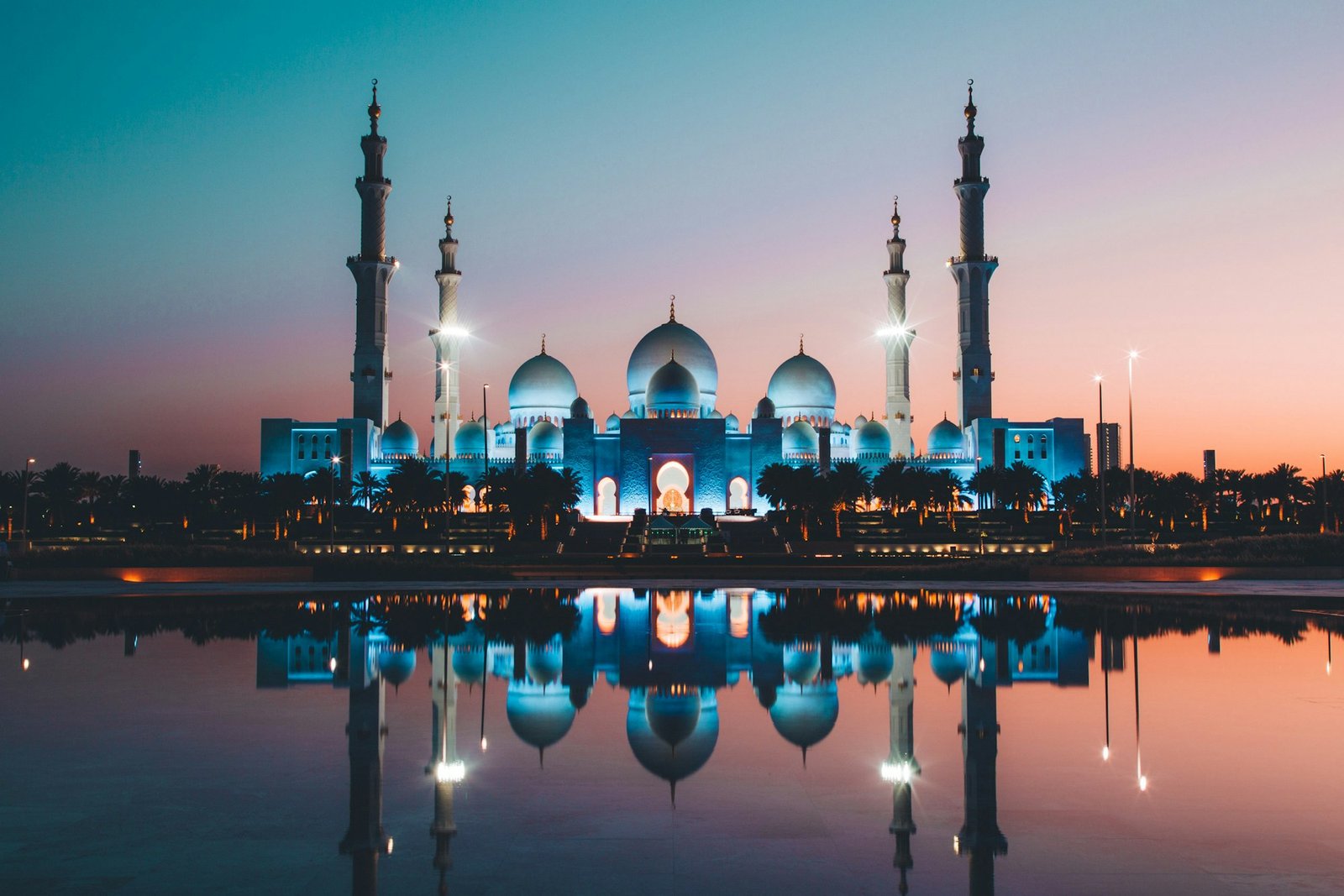 Sheikh Zayed Grand Mosque in Abu Dhabi, white domes against a blue sky
