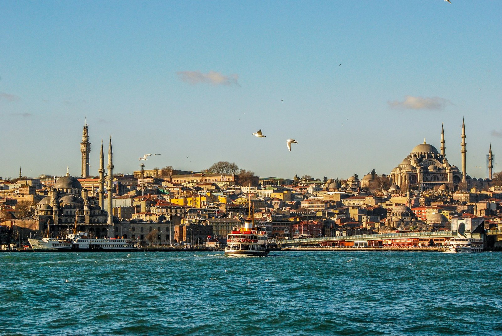 A ferry crossing the Bosphorus with the skyline of Eminönü in Istanbul